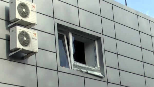 Взрывом гранаты выбило стекла в здании автомойки 