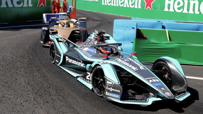 FILE PHOTO: Motor racing - Formula E - Santiago ePrix - Santiago, Chile - January 26, 2019   Panasonic Jaguar's Mitch Evans and DS Techeetah's Andre Lotterer in action during the race  REUTERS/Rodrigo Garrido/File Photo