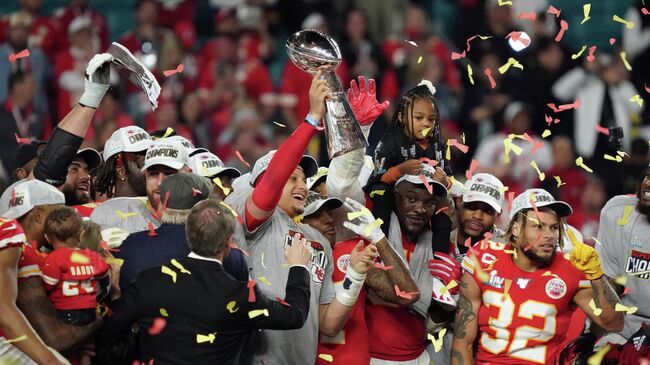 Feb 2, 2020; Miami Gardens, Florida, USA; Kansas City Chiefs quarterback Patrick Mahomes (15) hoist the Vince Lombardi Trophy after defeating the San Francisco 49ers in Super Bowl LIV at Hard Rock Stadium. Mandatory Credit: Kirby Lee-USA TODAY Sports