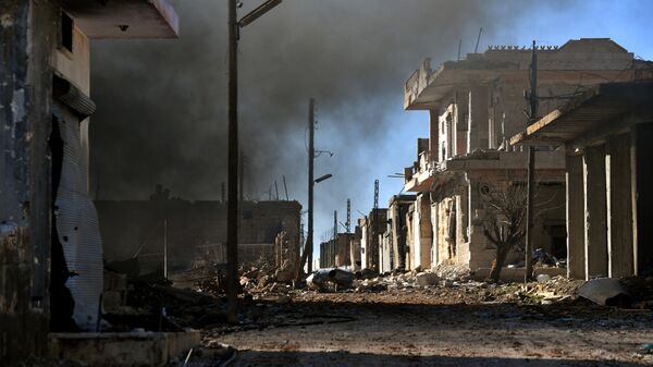 Разрушенные дома в населенном пункте ад-Дейр аш-Шаркий в Сирии на юго-востоке провинции Идлиб