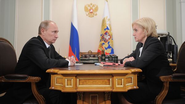 Президент России Владимир Путин и вице-премьер по социальным вопросам Ольгой Голодец
