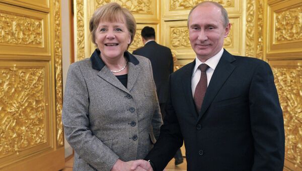 Президент РФ Владимир Путин и канцлер Германии Ангела Меркель. Архивное фото