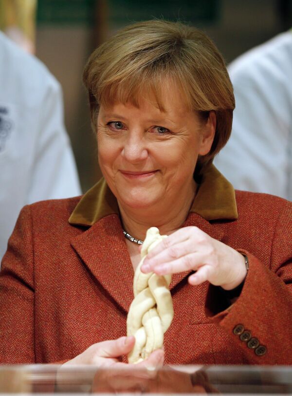 Канцлер Германии Ангела Меркель на сельскохозяйственной ярмарке в Берлине