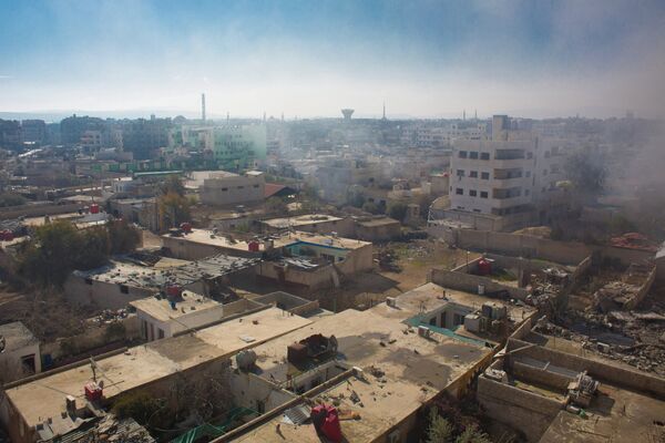 Вид на территорию, занятую боевиками Свободной армии Сирии, в городе Дарайя