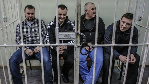 Бывший сотрудник МВД Максим Каганский (слева), обвиняемый в покушении на мошенничество