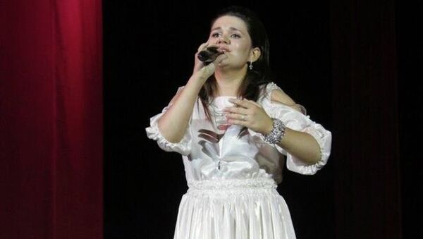 Победительница певческого шоу Голос 21-летняя Дина Гарипова