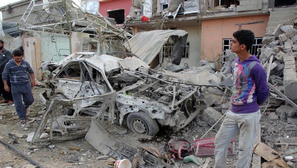 Последствия взрыва в пригороде Багдада