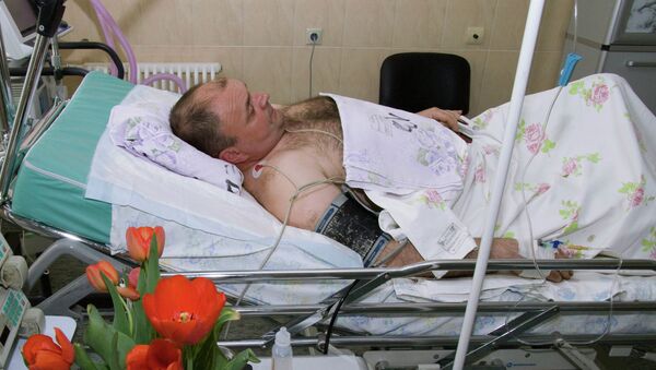 Майор полиции Юрий Седых, раненый при задержании подозреваемого в убийстве шести человек С.Помазуна