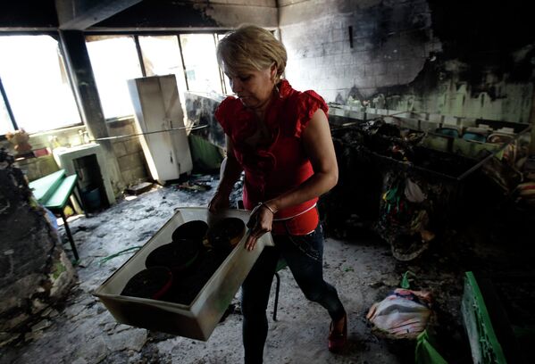 Преподаватель школы, разрушенной в результате взрыва автоцистерны с газом в Мексике
