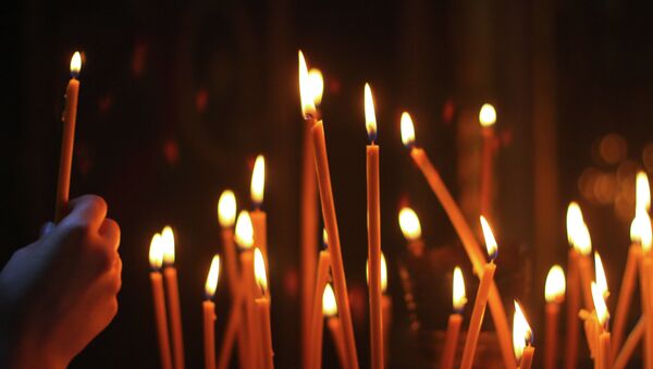 Свеча в церкви. Архивное фото