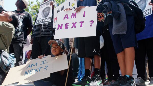 Протесты против оправдания убийцы чернокожего подростка в субботу в США