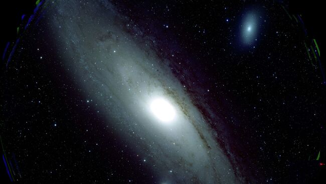 Туманность Андромеды и ее жертва - галактика М32