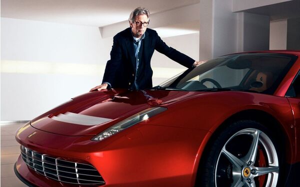 Музыкант Эрик Клэптон и автомобиль Ferrari SP12 EC