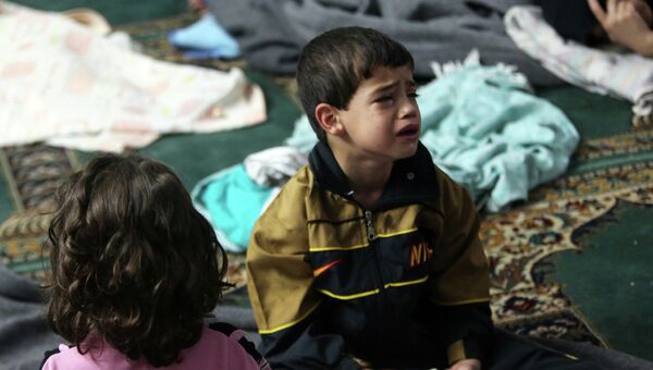 Мальчик в мечети Дамаска после химической атаки
