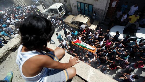 Похороны палестинцев, застреленных израильскими военными в предместье города Рамаллах