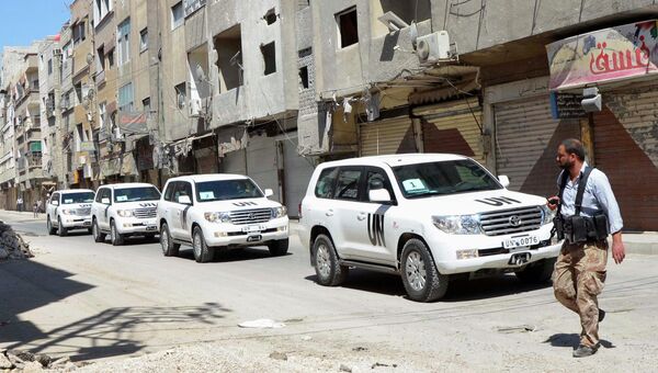 Колонна машин с инспекторами ООН по химическому оружию в Дамаске