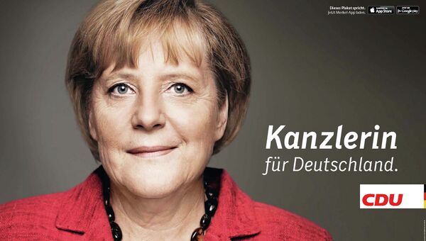 Плакат, на котором Ангела Меркель оживает, если посмотреть на него с помощью специального приложения