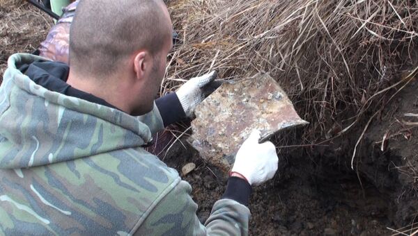 Работы по подъему из земли останков ЯК-9 в Приморье