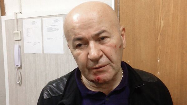 Резо Бухникашвили в отделении полиции после задержания за разбойное нападение на квартиру в центре Москвы. Фото с места события