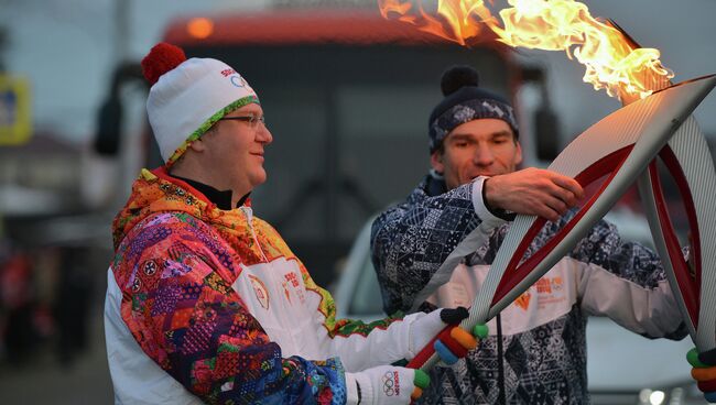 Руководитель Объединенной редакции новостей Российского агентства международной информации РИА Новости Олег Осипов во время эстафеты Олимпийского огня в Иркутске