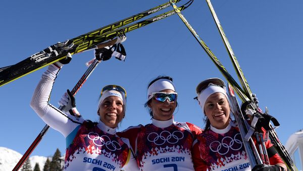 Слева направо: Шарлотт Калла (Швеция), Марит Бьорген (Норвегия), Венг Хейди (Норвегия) после финиша скиатлона в соревнованиях по лыжным гонкам среди женщин на XXII зимних Олимпийских играх в Сочи.