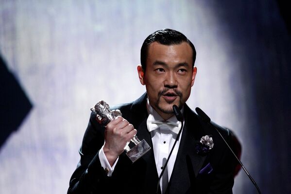 Актер Ляо Фан во время церемонии награждения победителей 64-го Берлинале