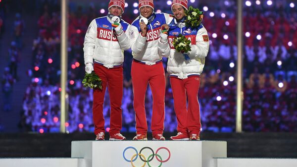 Максим Вылегжанин - серебряная медаль, Александр Легков - золотая медаль, Илья Черноусов - бронзовая медаль