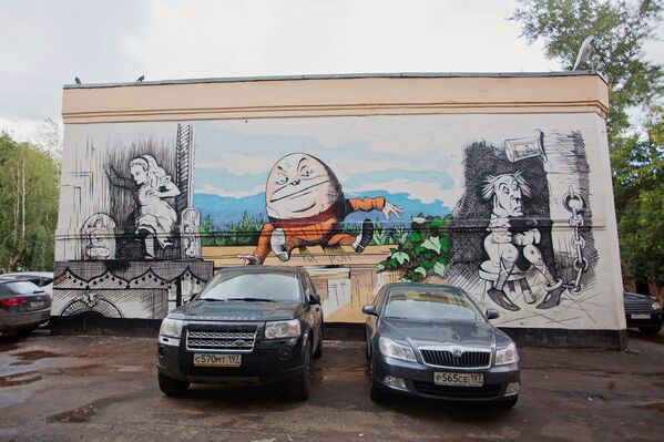 Граффити на стене дома - герои сказки Алиса в Стране чудес