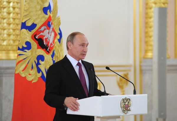 Президент России Владимир Путин выступает в Кремле на встрече с членами олимпийской сборной России