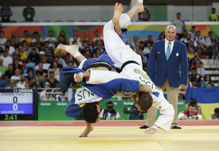 Хасан Халмурзаев и Трэвис Стивенс (слева направо)