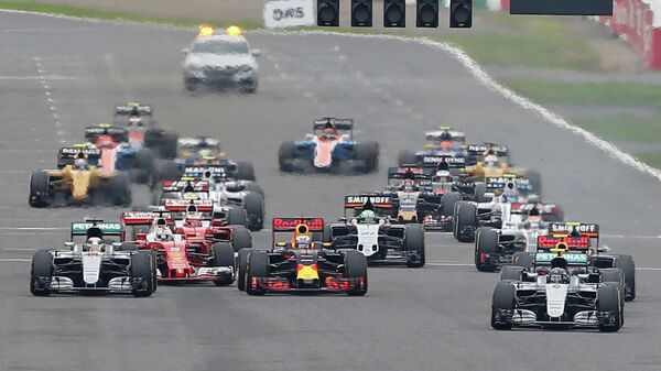 Пилоты во время гонки 17-го этапа чемпионата Формулы-1 Гран-при Японии