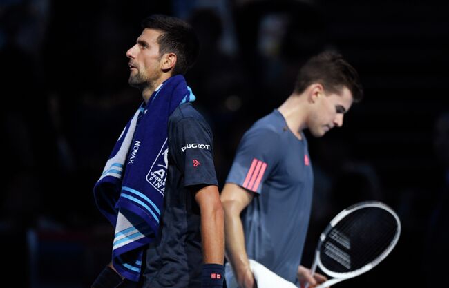 Сербский теннисист Новак Джокович и австриец Доминик Тим (слева направо)