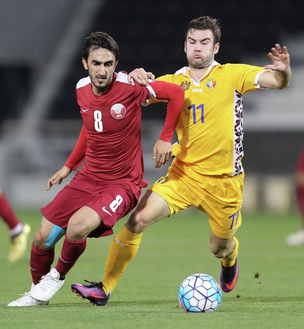 Игровой момент матча Катар - Молдавия