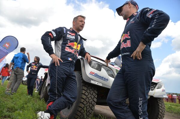 Пилоты команды Peugeot Себастьян Лёб (слева) и Стефан Петерансель