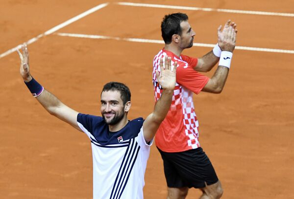 Хорватские теннисисты Марин Чилич и Иван Додиг (слева направо)