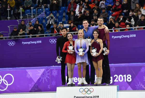 Суй Вэньцзин и Хань Цун, Алена Савченко и Брюно Массо, Меган Дюамель и Эрик Рэдфорд (слева направо)