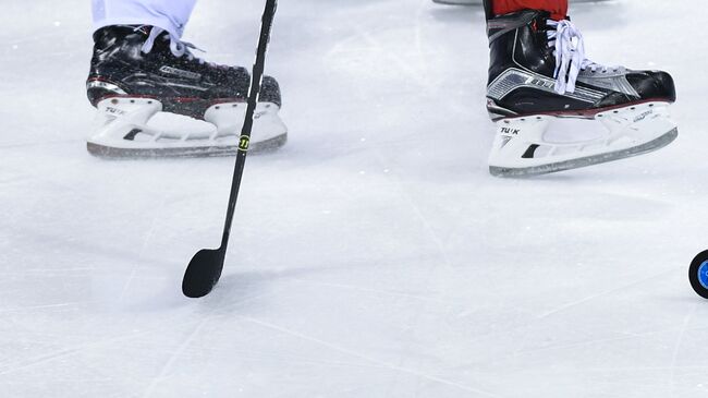 Игровой момент хоккейного матча на олимпийском турнире в Пхенчхане