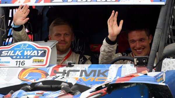 Экипаж команды SNAG Racing пилот Сергей Карякин и штурман Антон Власюк (справа налево)
