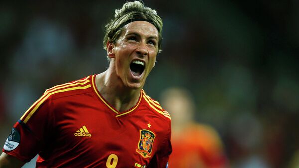 Fernando Torres celebrates after scoring a goal