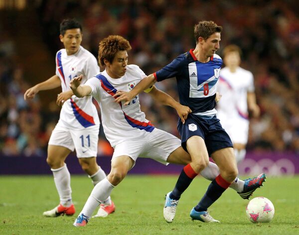 Игровой момент матча Великобритания - Южная Корея
