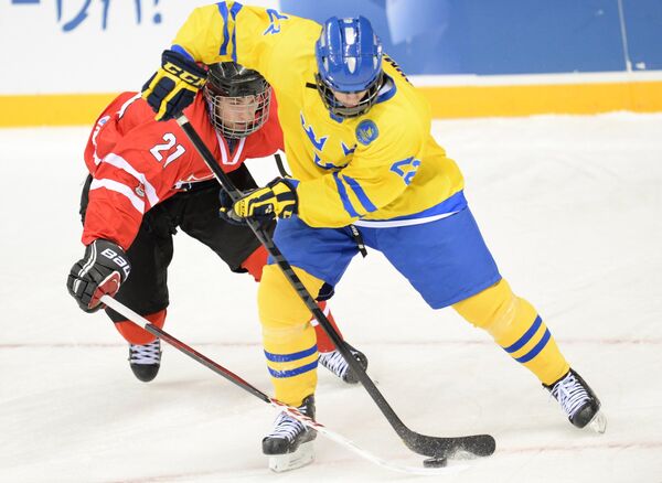 Игровой момент матча Швеция - Канада