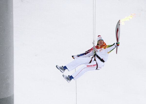 Чемпион мира по ледолазанию в 2013 года Алексей Томилов во время эстафеты олимпийского огня в Кирове
