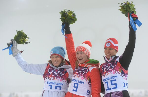 Тура Бергер, Дарья Домрачева и Тея Грегорин (слева направо)