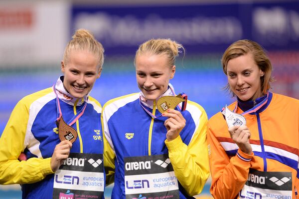 Мишель Коулман (Швеция), завоевавшая бронзовую медаль, Сара Сьестрем (Швеция), завоевавшая золотую медаль, и Фемке Хемскерк (Нидерланды)