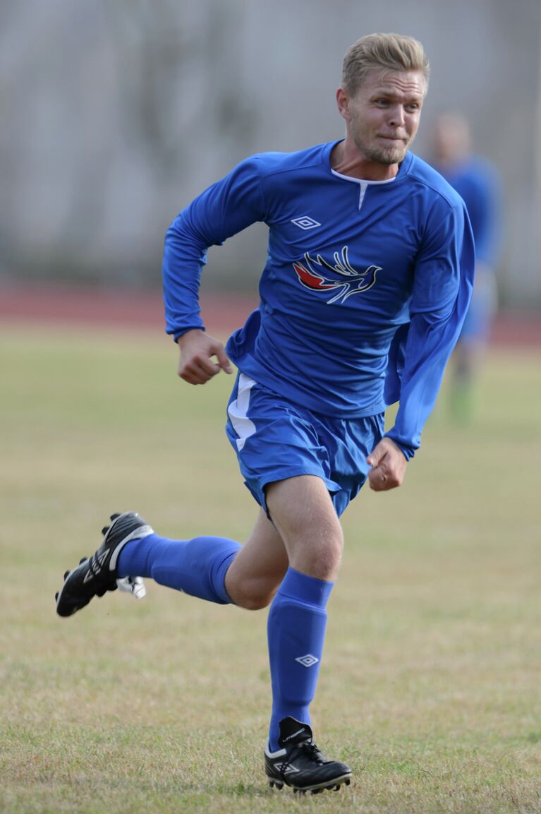 Гонщик команды Макларен Кевин Магнуссен Гонщик команды Макларен Кевин Магнуссен