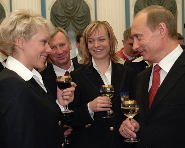 Ольга Зайцева и Владимир Путин (на первом плане)