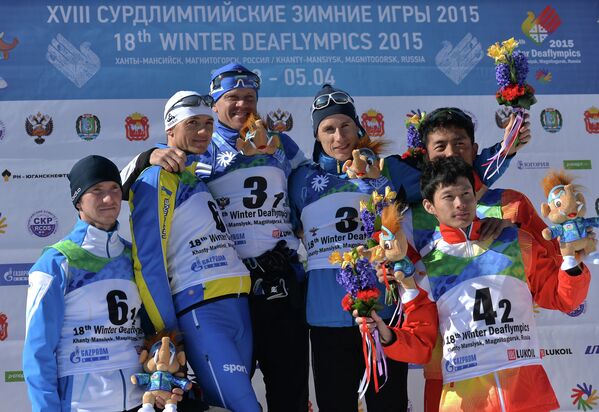 Призеры командного спринта в соревнованиях по лыжным гонкам среди мужчин на XVIII Сурдлимпийских зимних играх в Ханты-Мансийске