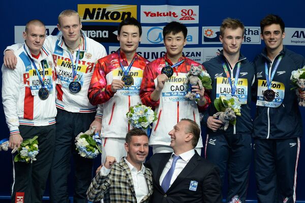 Евгений Кузнецов и Илья Захаров (Россия) - серебряная медаль, Цао Юань и Цинь Кай (Китай) - золотая медаль, Джек Лафер и Крис Мирс (Великобритания) - бронзовая медаль (слева направо)
