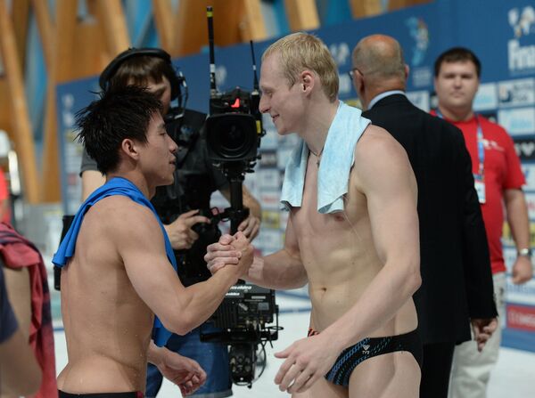 Хэ Чао (Китай) и Илья Захаров (Россия) (слева направо)