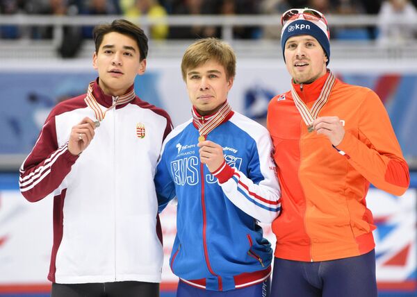 Шандор Лю Шаолинь (Венгрия) - серебряная медаль, Семён Елистратов (Россия) - золотая медаль, Фрек ван дер Варт (Нидерланды) - бронзовая медаль (слева направо)
